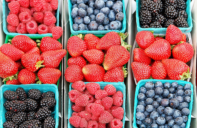 A bowl of berries with a calming atmosphere for mental health stress relief and good mood